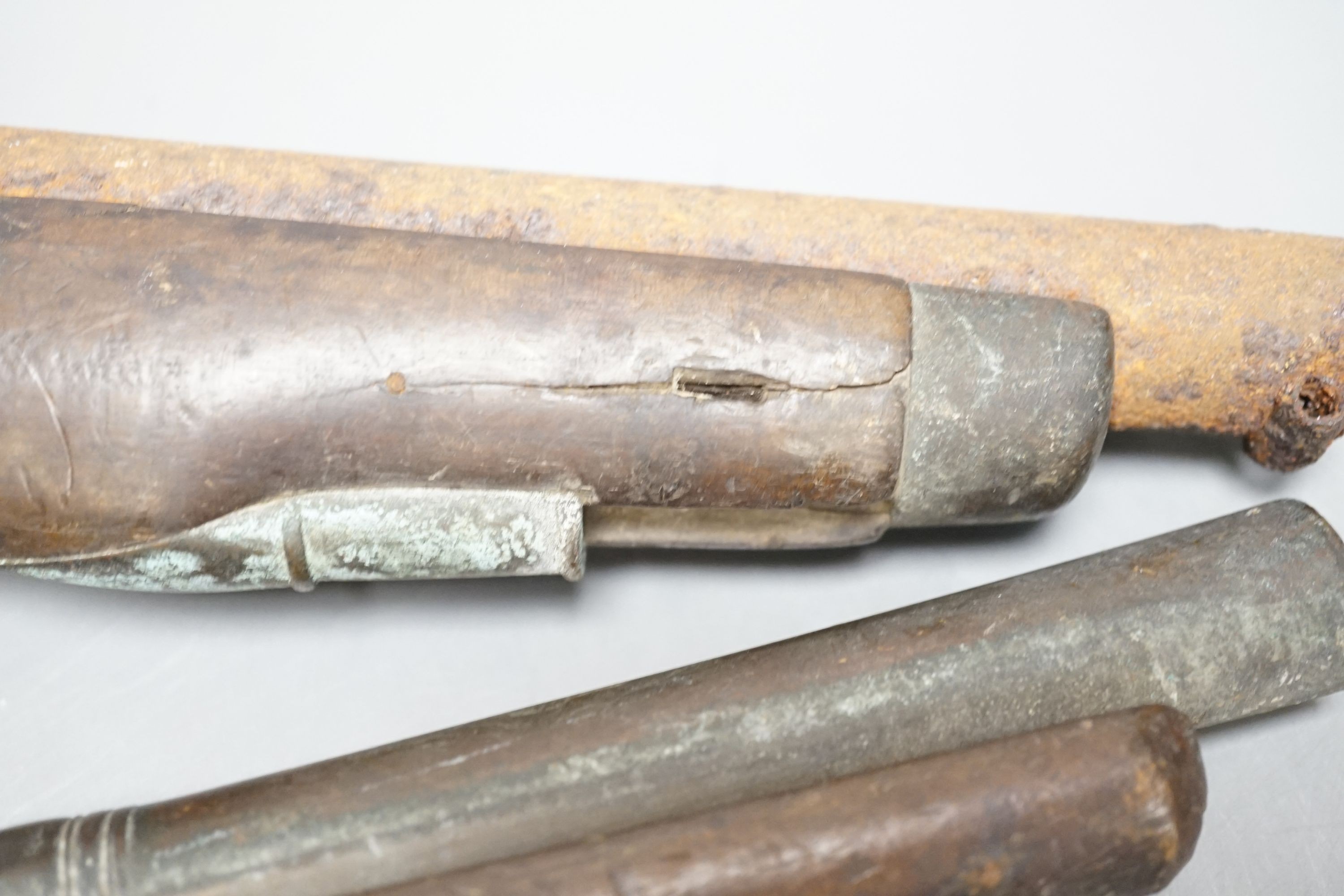 Two 19th century flintlock pistols and a pocket pistol, largest 40 cms long.
